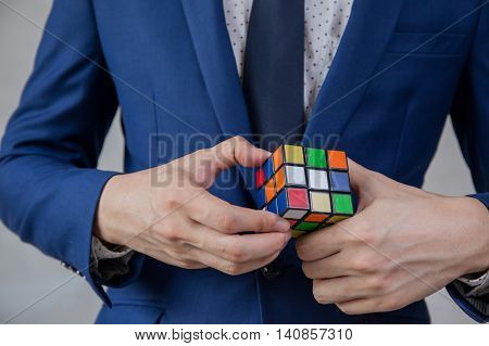 Businessman Solving Cubic Problems - Problem Solution And Making Strategic Moves Concept