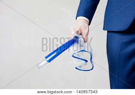 Businessman Holding Snorkeling Goggle In White Background - Business Vacation Concept