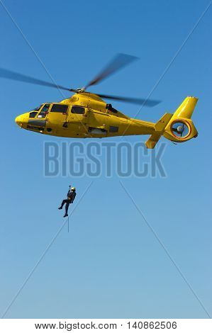 ROTTERDAM, HOLLAND - SEP 7, 2012: Demonstration of a rescue operation by helicopter during the World Harbor Days.