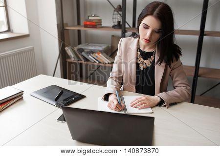 Female cartoonist drawing at office. Creative woman illustrator designing new sketch