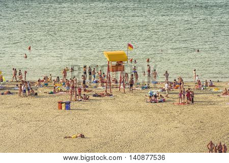 Mamaia Romania - July 18 2016:People resting on beach on in MamaiaMamaia is the and best known resort on Romanian Riviera.It's situated on 8km long and 300m wide sandy land strip at the Black Sea.