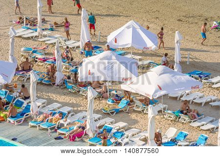 Mamaia Romania - July 18 2016: People having fun on beach in MamaiaMamaia is the best known resort on Romanian Riviera.It's situated on 8km long and 300m wide sandy land at the Black Sea.