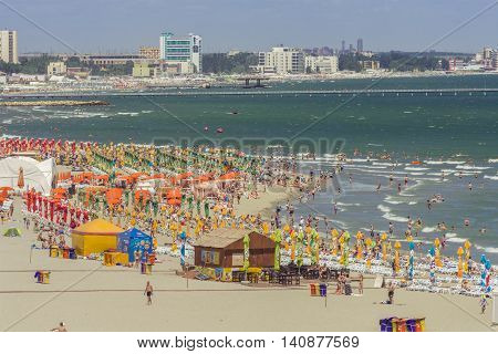 Mamaia Romania - July 18 2016: People enjoying on beach in Mamaia Mamaia is the best known resort on Romanian Riviera.It's situated on 8km long and 300m wide sandy land at the Black Sea.
