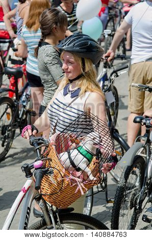 Kharkiv Ukraine - June 18 2016: Cyclists in carnival costumes in a themed bike ride "Girls in stripes" held in the center of Kharkiv