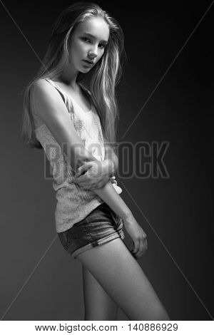 Fashion Model With Long Hair, Beautiful Eyes, Perfect Skin Is Posing In Studio For Glamour Test Phot