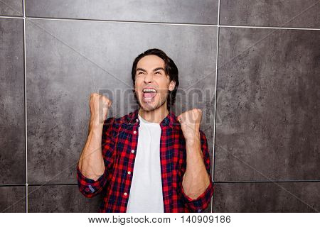 Portrait Of Happy Man Rise Up Hands And Successful Achievement Of Goals