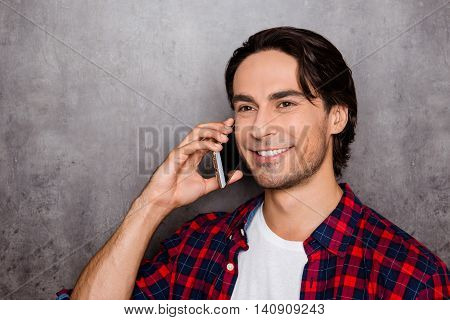 Happy Young Man Talk Cellphone And Smiling