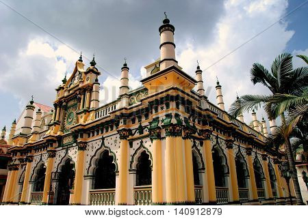 Singapore - December 18 2007 1907 Masjid Abdul Gaffoor Mosque in Little India with its 22 small minarets Moorish windows and decorative entrance pediment
