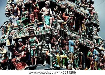 Singapore - December 14 2007: 72 deities adorn the Sikhara tower above the entrance to 1827 Sri Mariamman Hindu Temple in Chinatown