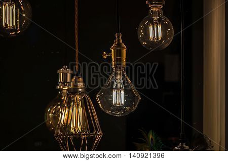 yellow lightning bulb shining in the dark