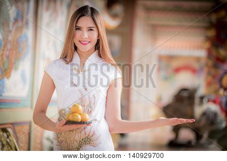 Asian Chinese Woman In Traditional Chinese Holding Orange Pay Respect