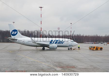 ST. PETERSBURG RUSSIA - DECEMBER 12 2015: A Boeing 737-500 (VQ-BJQ) UTair airline is preparing to fly to Pulkovo airport