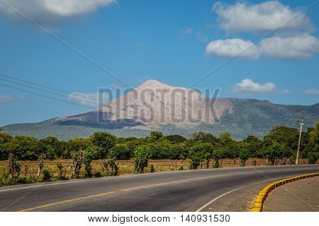 Telica volcano view from Nicaragua with road and blue sky
