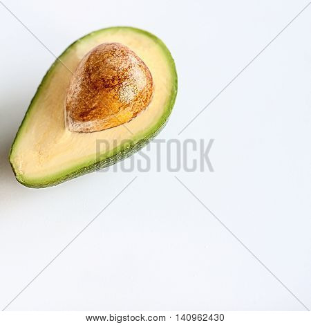 Avocado Cut In Half With Pit Seed On White Background