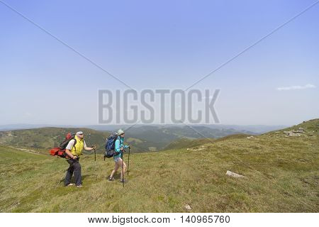 Hiking in the mountains in the summer on a sunny day.