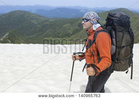 Hiking in the mountains in the summer on a sunny day.