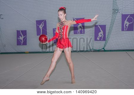 Warsaw Poland - June 25 2016: Young gymnast is with a ball