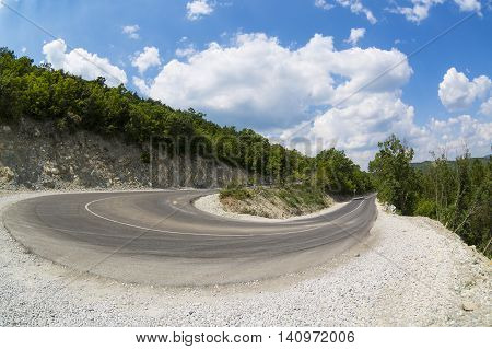 Summer serpentine road in Abrau-Durso, Russia. Famous place of Fizz production