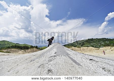 BERCA ROMANIA - JULY 2: Tourists visiting the mud active volcanoes in Berca on June 2 2016 in Romania