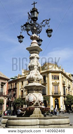 SEVILLE, SPAIN - September 13, 2015: Detail of the magnificent water fountain at Plaza Virgen de los Reyes on September 13, 2015 in Seville, Spain