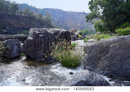 Da Nhim river near pongour vietnam in dry season with rock on the bottom of the stream