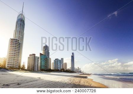 The Autumn Sun Sets Behind Broadbeach Skyline After A Warm Day In The Gold Coast, Queensland, Austra