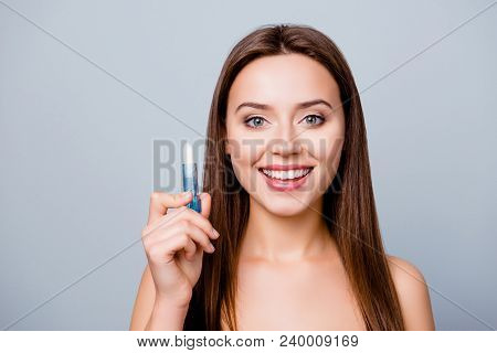Concept Of Using Lipbalm In Cold Weather. Close Up Portrait Of Happy Charming Smiling Woman Showing 