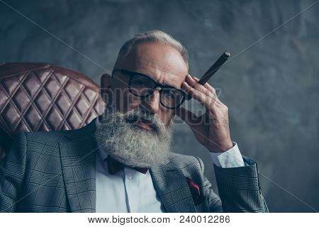 Close Up Of Dreamy Gentlemen,  Selective, Bearded Investor In Glasses, Hold Hand With Cigar On Templ