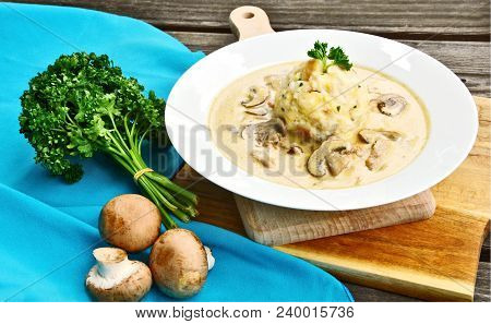 Sour Mushroom Sauce With Bread Dumpling (german Name Is Saure Schwammerlso