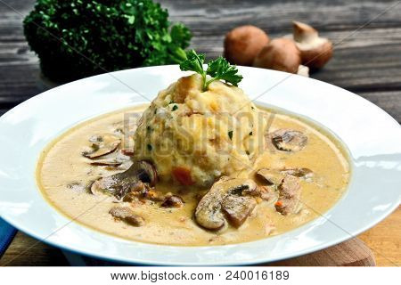 Sour Mushroom Sauce With Bread Dumpling (german Name Is Saure Schwammerlso