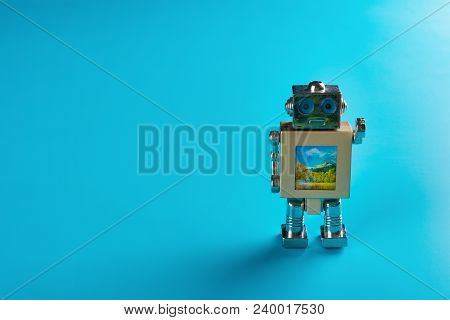 Metal Toy Robot On A Blue Background
