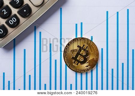 Bitcoins And Caculator On A Chart As Financial Conceptbitcoins And Caculator On A Chart As Financial