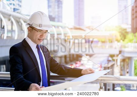 Asian Business And Engineer Man Has Planning And Working For Design Buiding And City.