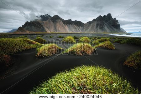 Majestic landscape on sunny day. Location Stokksnes cape, Vestrahorn (Batman Mount), Iceland, Europe. Scenic image of most popular tourist attraction. Travel destination. Discover the beauty of earth.