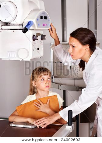 Little girl with doctor radiologist.
