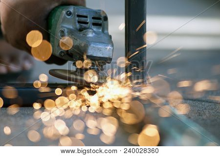 The Worker Is Welding Metal Part Of Table Steel In Factory.