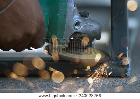 The Worker Is Welding Metal Part Of Table Steel In Factory.