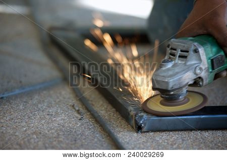 The Worker Is Welding Metal Part Of Table Steel In Factory.