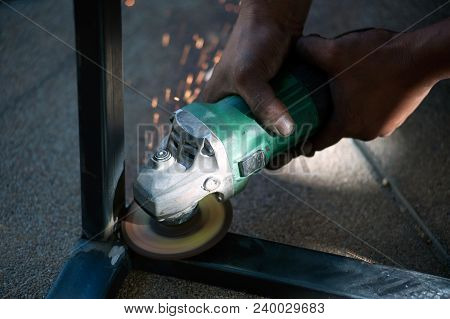 The Worker Is Welding Metal Part Of Table Steel In Factory.