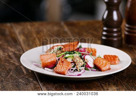 Red Fish Salmon With Radish And Spinach, Served On White Plate On Wooden Table. Rustick Style. View 