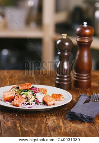 Red Fish Salmon With Radish And Spinach, Served On White Plate On Wooden Table. Rustick Style. View 