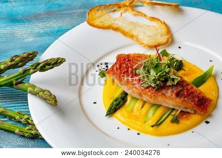 Seasoned Roasted Green Asparagus With Grilled Salmon On Polenta. Gourmet