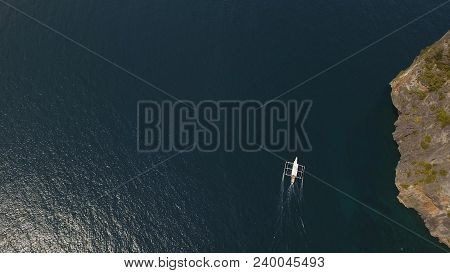 Aerial View Of Motor Boat In Sea. Aerial Image Of Motorboat Floating In A Turquoise Blue Sea Water. 
