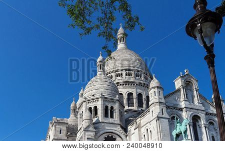 The Basilica Sacre Coeur Is A Roman Catholic Church Located At The Summet Of The Butte Montmartre , 
