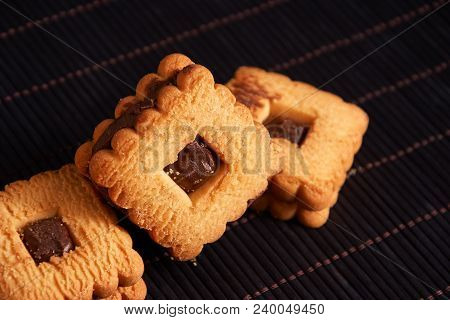 Chocolate Cookies On Gray Plate On Black Wooden Table