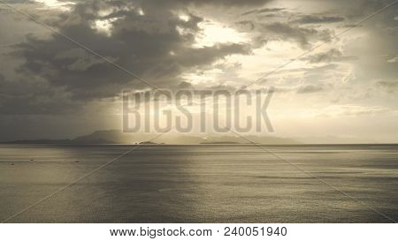 Sunset Over The Sea. Sunset Over The Sea In The Background Orange Sky And Islands. Fly Over The Ocea