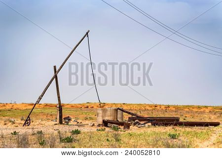Beautiful Landscape With Old Sweep Well And Shadoof In Steppe