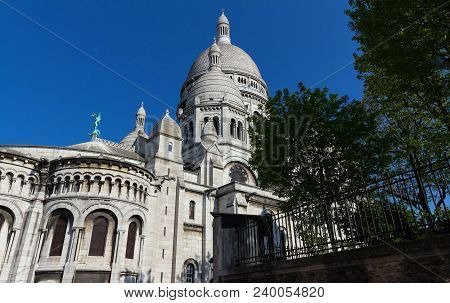 The Basilica Sacre Coeur Is A Roman Catholic Church Located At The Summet Of The Butte Montmartre , 