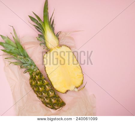 Half Cut Juicy Pineapple On A Pastel Pink Background. Minimal Summer Concept.