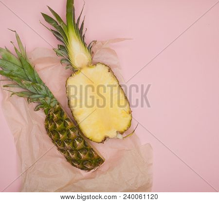 Half Cut Juicy Pineapple On A Pastel Pink Background. Minimal Summer Concept.